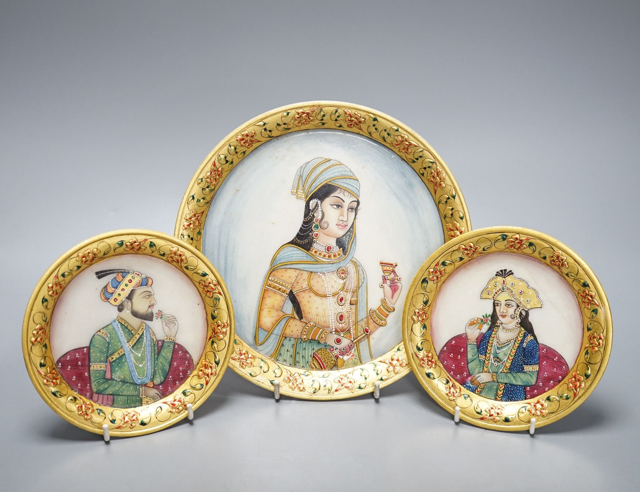 Three Indian alabaster, gilt bordered plates depicting Indian Royalty, 22cm